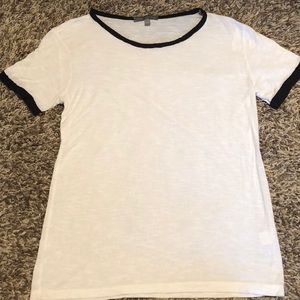 White t-shirt with black on the collar and sleeves